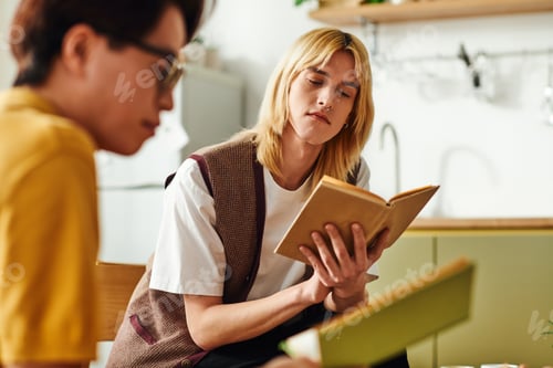 Preview: Young men engage in insightful discussions at home book club gathering in cozy environment