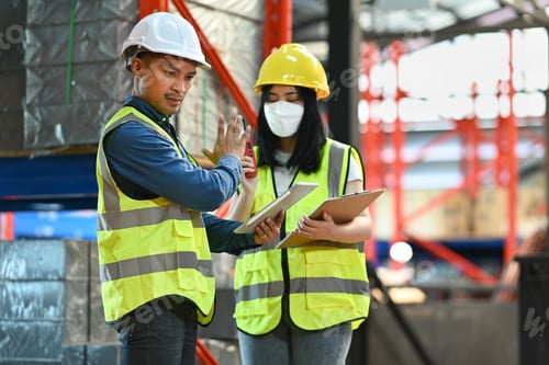 Preview: Storehouse workers are checking stock and inventory in retail warehouse.