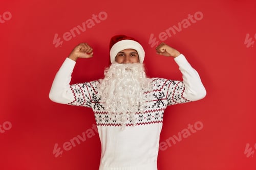 Preview: Santa Claus Showing Biceps. Portrait of Confident Proud Man Showing Biceps