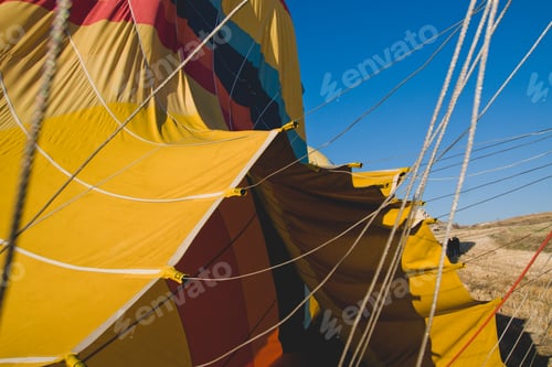 Preview: Colorful balloons flying over mountains and with blue sky