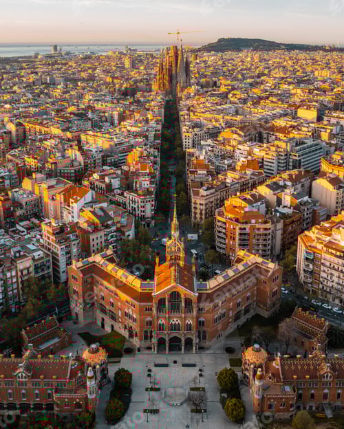 Preview: Aerial view of Barcelona Eixample residential district and Sagrada Familia Basilica at sunrise