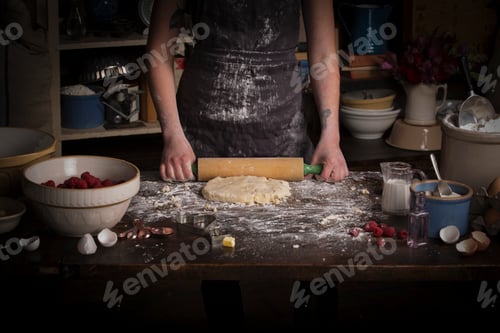 Preview: Valentine's Day baking, woman rolling out dough with a rolling pin.