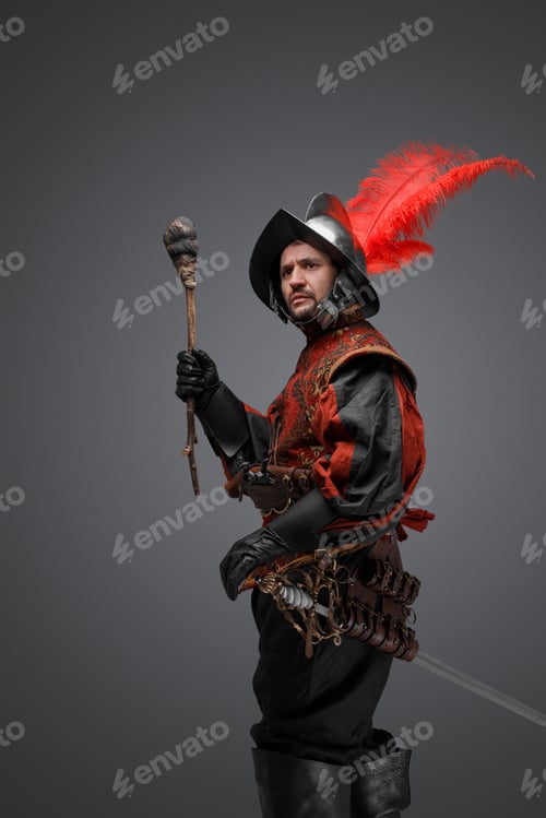 Preview: Medieval conquistador dressed in stylish clothes holding torch