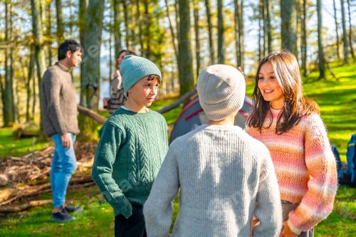 Preview: Children talking in the forest while camping with their parents