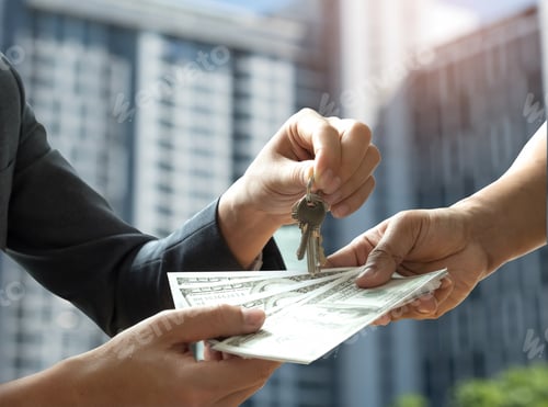 Preview: Hand people are paying the dollar with other hand holds the keys.