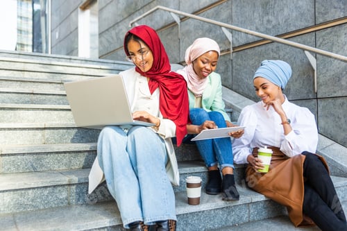 Preview: Beautiful muslim girl wearing hijab bonding outdoors