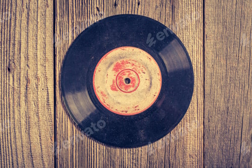 Preview: One old scratched vinyls on wooden table