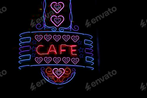 Preview: Scenic shot of a vintage neon Cafe sign on a restaurant building