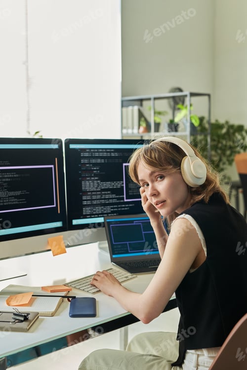 Preview: Portrait of Young Caucasian Woman Developing Neural Network on Computer