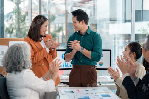 Preview: Business team applauding during a meeting in the office