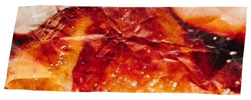 Preview: Crumpled piece of fiery brown paper cut out from magazine for collage, isolated wrinkled scrap