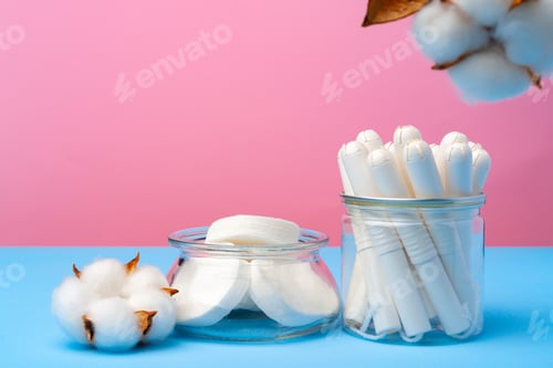 Preview: Female medical tampons on pink and blue background