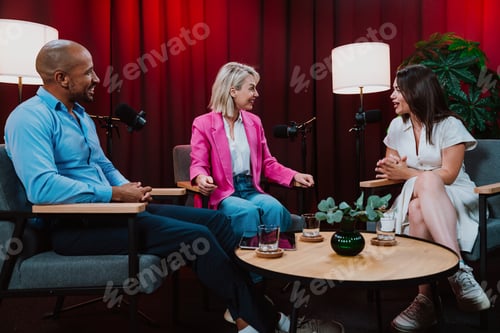 Preview: Content creators broadcasting live podcast interview using microphones