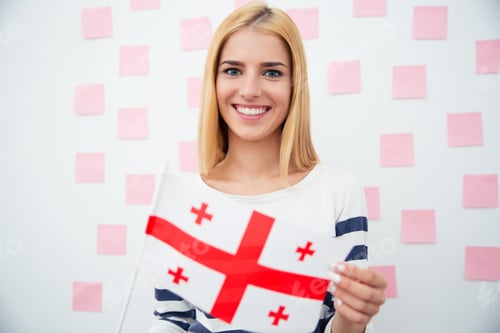 Preview: Happy Young Woman Holding Georgia Flag