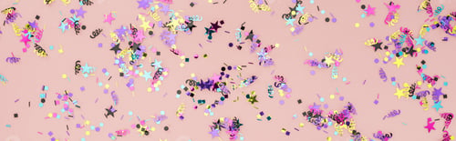 Preview: Panoramic shot of colorful confetti on pink party background