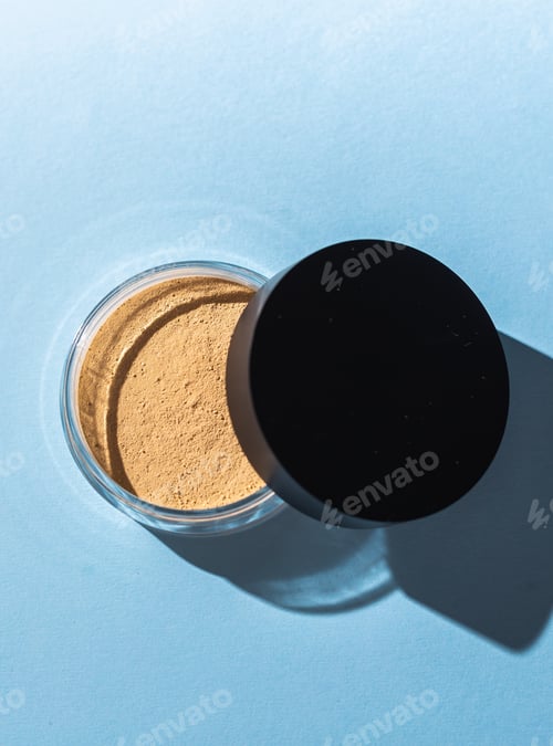 Preview: Mineral powder foundation isolated on blue background. Eco-friendly and organic beauty products
