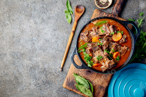 Preview: Beef ribs Bourguignon. Beef ribs stewed with carrot, onion in red wine. France dish. Top view