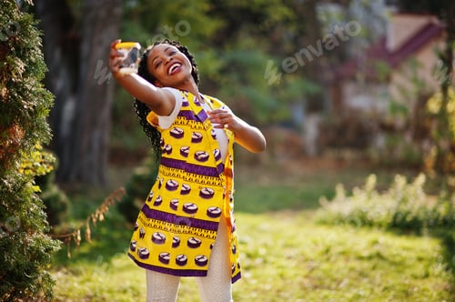 Preview: African woman in yellow