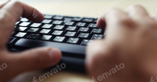Preview: Close up of typing on keyboard