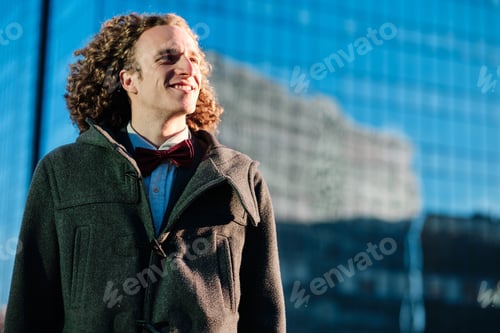 Preview: Portrait of a man standing outdoors on the street.