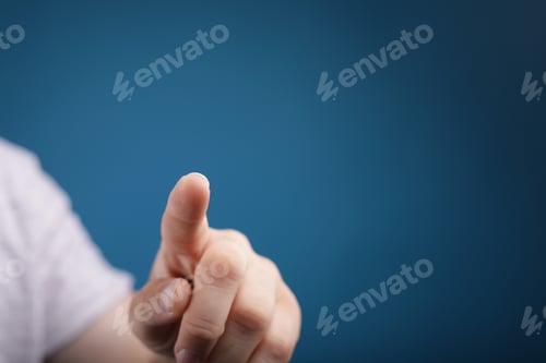 Preview: Man pointing his finger on a blue background