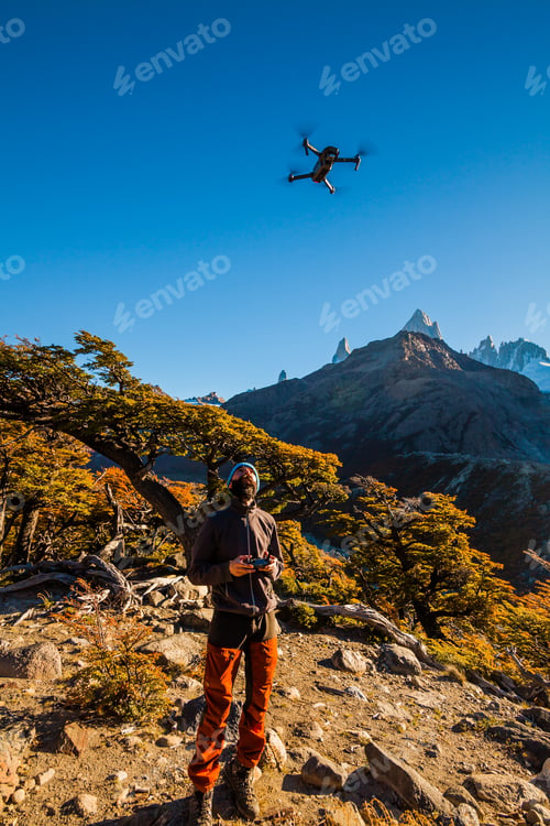Preview: Tourist with drone on a background of mountain landscape. Patagonia