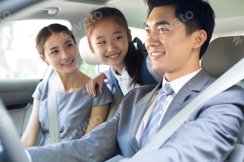 Preview: Young couple with daughter riding in car together