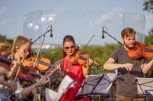 Preview: Violin players playing classic music on the street