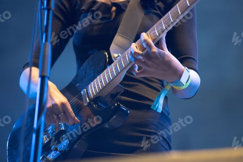 Preview: Closeup of musician's hands playing electric guitar