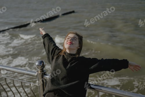 Preview: girl with glasses enjoys the sea nature