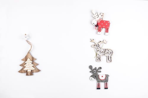 Preview: three wooden deers on white christmas background