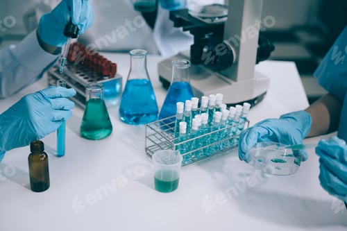 Preview: Science and medicine, scientist analyzing and dropping a sample into a glassware
