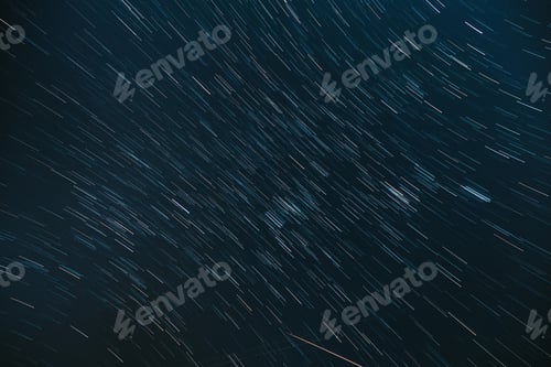 Preview: Meteors Trace On Night Dark Blue Sky Background. Bewitching Illusion Of Star Trails. 5k . Spin Of