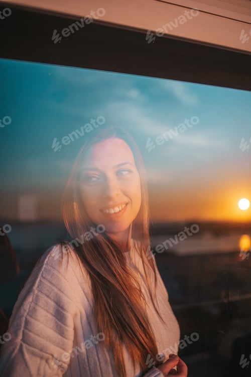 Preview: Young woman behind a window