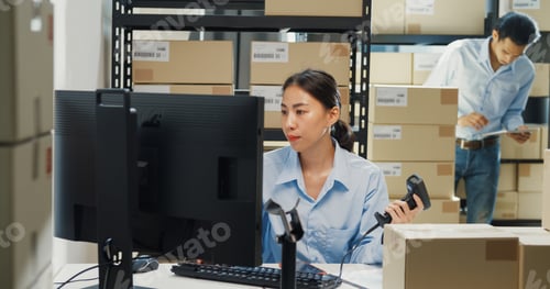 Preview: Partner computer use barcode machine scan record customer online data at warehouse.