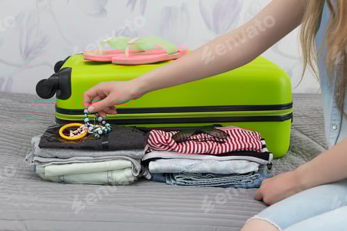 Preview: Packing things for travel in a suitcase