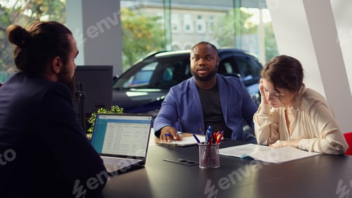 Preview: Dealership clients reading contract terms and conditions