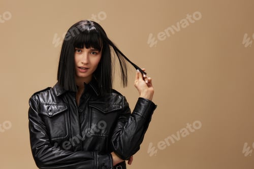 Preview: Self confident pretty adorable brunet lady in leather jacket flirting at camera posing isolated on