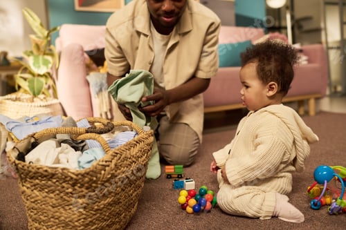 Preview: Young Adult Black Man Caring for Baby during Paternity Leave at Home