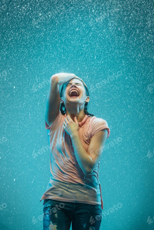 Preview: The portrait of young beautiful woman in the rain