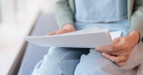 Preview: Woman holding paper note and do revision