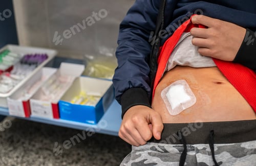 Preview: Young teenage boy in hospital. Concept for wound from surgery.