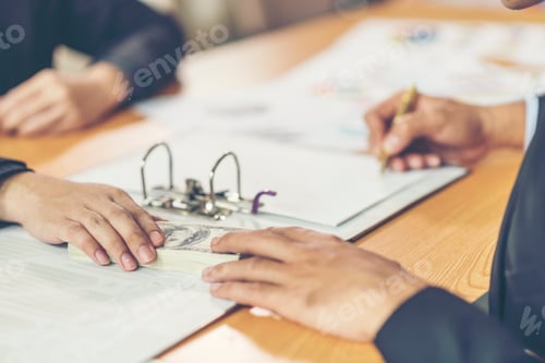 Preview: close up hand of marketing manager employee pointing at business document during discussion