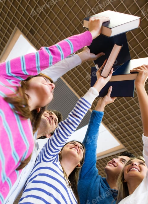 Preview: Happy Group Of Students Holding Books In The Air