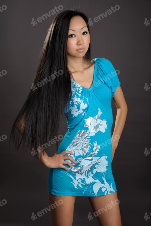 Preview: Portrait Of Cute Female Fashion Model Posing On Dark Background
