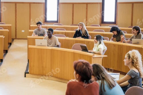Preview: Group of university students in an amphitheater-shaped classroom in a master class