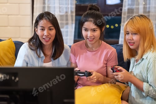 Preview: Three Young Women Playing Video Games at Home