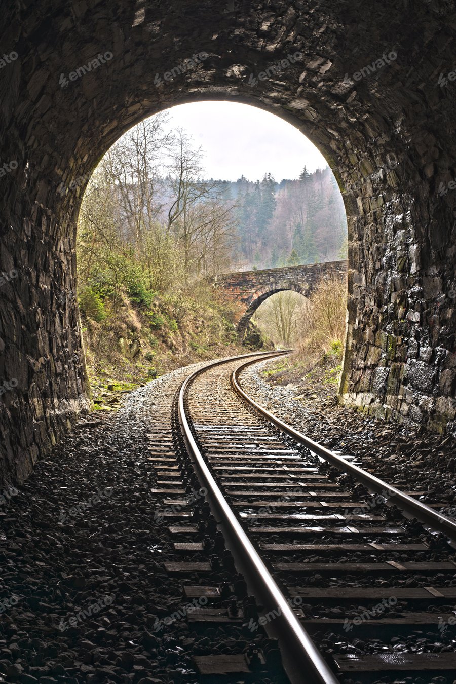Cover for Exit of Vintage train stone tunnel with view on a stone bridge