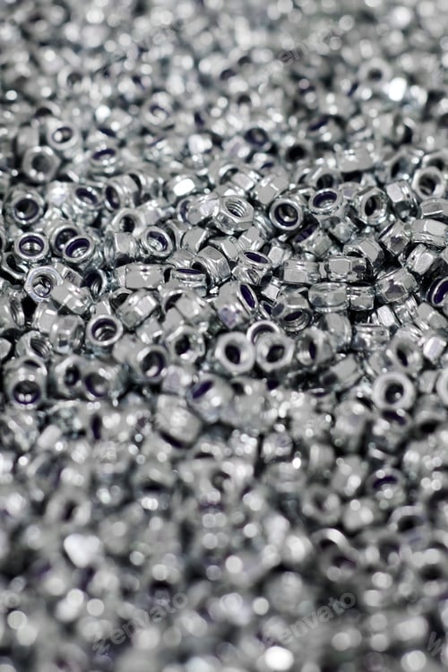 Preview: Bunch of galvanized hexagon locknuts for bolts, fasten multiple parts together, hardware fasteners