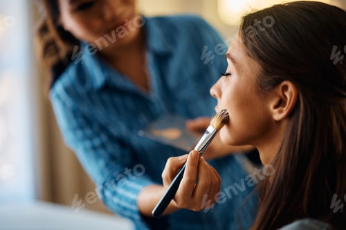 Preview: Close up of a woman having makeup treatment at beautician's.